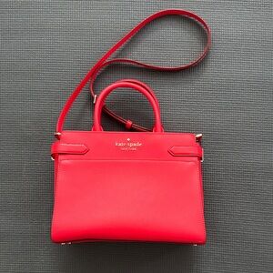 kate spade red leather satchel with top handles and crossbody strap
